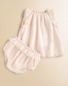 Rows of fluffy ruffles add charm to a sweet woven cotton frock with a gently flared shape.Elasticized gathered necklineSleeveless with ruffled trim at arm openingsKeyhole button-and-loop back closeMatching ruffled bloomers with elasticized waist and leg openingsCottonMachine washImported