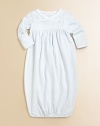 Adorable, long-sleeved gown in soft, cotton jersey.Cross-wrap necklineLong sleeves with fold-over cuffsPullover styleEmpire waist with gathered detailGathered elastic bottomCottonMachine washImported