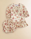 A sweet floral print adorns this girlie dress that comes with matching bloomers.Peter Pan collarLong sleeves with ruffled hemButton-frontDrop waistRuffled hemCottonMachine washImported Please note: Number of buttons may vary depending on size ordered. 