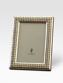 Memories are cherished like jewels, so it's only fitting that a photograph sit within a frame inspired by fine jewelry with hand-applied Swarovski crystals and fresh-water pearls. From the Perlée Collection Accommodates a 8 X 10 photograph Brass with Swarovski crystals & fresh-water pearlsBeveled glass, satin liner, leather backImported Memories are cherished like jewels, so it's only fitting that a photograph sit within a frame inspired by fine jewelry with hand-applied Swarovski crystals and fresh-water pearls. From the Perlée Collection Accommodates a 8 X 10 photograph Brass with Swarovski crystals & fresh-water pearlsBeveled glass, satin liner, leather backImported