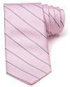 An immaculate silk tie with a classic pinstripe pattern from Michael Kors brings a bit of panache to your office attire.