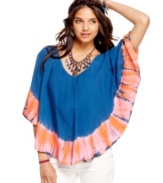 Crisscross back straps and a tie-dye trim make for a fusion of cool design on this poncho from American Rag -- where comfy-cute meets urban boheme!