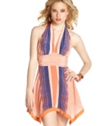 A lively print adds maximum color to this sweet yet vixenish halter dress from GUESS? -- a  hot style for blazing days!