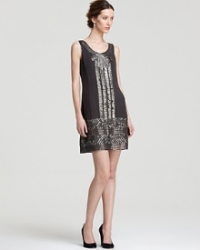 Boasting an intricate pattern of beads and sequins, this Adrianna Papell dress is reminiscent of 20s-era glamour. Boasting an intricate pattern of beads and sequins, this Adrianna Papell dress is reminiscent of 20s-era glamour.