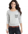 Flaunting a sequined pocket, cozy long sleeves and a banded waist, this sweatshirt-style top by Jolt is the perfect choice for lounging while looking fabulous.