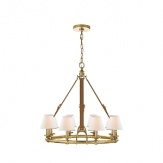 Elegantly rendered in luxurious saddle leather and brass, this modern Ralph Lauren chandelier illuminates through eight bulbs topped with textural linen shades.
