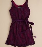 A quiet elegance infuses this petite lace dress, designed for your favorite little fashionista by Un Deux Trois.