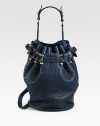 Gorgeous pebble-grain leather in a roomy drawstring bucket silhouette finished with antiqued brass hardware and dual strap options.Top handle, 8¼ dropDetachable adjustable crossbody strap, 14½-20¼ dropDrawstring closureOne outside open pocketProtective metal feetOne inside zip pocketTwo inner compartmentsFully lined11½W X 8H X 5DImported
