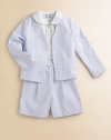 An adorable preppy seersucker set includes a crisp button-down shirt