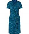 Issas effortlessly elegant signature draping and gathering are on full display with this bold, royal blue and green printed viscose jersey dress - Fitted, feminine cut fetchingly contours curves - Wrap-style bodice with deep v-neck and short sleeves - Slim, drape front skirt with decorative embellishment at hip - Hits at knee and zips at side - Ideal for any number occasions, seamlessly transitions from day to evening - Pair with platform pumps or strappy sandals and style with a cropped leather jacket