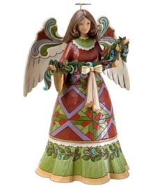 Ready to hang a string of festive garland, this folk-inspired angel will quickly become a centerpiece in your home. A geometric print dress, flourished wings and a wash of Christmas color add a timeless warmth. Ready to hang a string of festive garland, this folk-inspired angel will quickly become a centerpiece in your home. A geometric print dress, flourished wings and a wash of Christmas color add a timeless warmth.