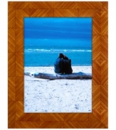 Panels of rich wood grain have a geometric effect on Tizo's handcrafted picture frame, offering bold style in shades of cinnamon and gold.