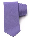 Rock this skinny purple tie whenever you need a modern downtown accent.