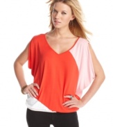 A pretty palette plus draped batwing sleeves equal the ideal top to wake up your neutral jeans! From Guess?.