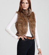 Wrap yourself in trend-right opulence with this Style Portfolio faux fur vest, boasting a sculpted cutaway hem and chic funnel collar.