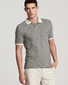 A super-soft polo tailored for a classic fit features a contrast collar and sleeve edge for an added dimension.