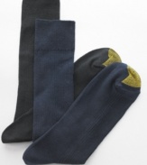 Softly spun for a sleek finish, these ribbed dress socks from Gold Toe come in a convenient four-pack to jump start your workweek.