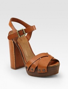 Richly hued leather with a chunky heel, adjustable ankle strap and decorative stitching. Leather-covered heel, 5 (125mm)Covered platform, 1½ (40mm)Compares to a 3½ heel (90mm)Shaft, 17Adjustable leg circumference, 15Leather upperLeather liningWooden solePadded insoleMade in ItalyOUR FIT MODEL RECOMMENDS ordering one size up as this style runs small. Richly hued leather with a chunky heel, adjustable ankle strap and decorative stitching. Leather-covered heel, 5 (125mm)Covered platform, 1½ (40mm)Compares to a 3½ heel (90mm)Shaft, 17Adjustable leg circumference, 15Leather upperLeather liningWooden solePadded insoleMade in ItalyOUR FIT MODEL RECOMMENDS ordering one size up as this style runs small.