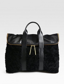 A mix of smooth leather and luxurious shearling come together in an elegant and distinctive style, perfectly sized for all your essentials.Double top handles, 4 dropFold-over zip closureOne inside zip pocketFully lined16¼W X 12½H X 6¾DImported