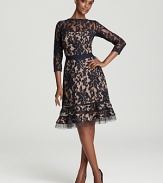 Tadashi Shoji's lace dress lends drama with a flared hem, detailed with sheer mesh stripes for a modern look.