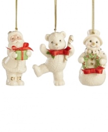 A set of three happy-go-lucky ornaments decorate your tree, featuring Santa Claus, a teddy bear and a snowman with gold embellishments and red ribbon bows. Crafted of porcelain from Lenox. A set of three happy-go-lucky ornaments decorate your tree, featuring Santa Claus, a teddy bear and a snowman with gold embellishments and red ribbon bows. Crafted of porcelain from Lenox.