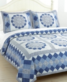Blue blossoms in an array of fabrics create a mosaic of pure tranquility. The Blue Dahlia quilt set is hand-pieced for a traditional look and feel that makes a wonderful update for master and guest bedrooms alike. Blue blossoms in an array of fabrics create a mosaic of pure tranquility. The Blue Dahlia quilt set is hand-pieced for a traditional look and feel that makes a wonderful update for master and guest bedrooms alike.
