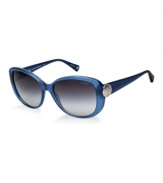 Sabrina follows one of the hottest trends of the season-cat eye.  This fashionable look by Coach is in blue with grey, gradient lenses or dark green with green, gradient lenses. The popular C disc configuration at the temples originates from the iconic pattern featured on best-selling Coach handbags. A Coach Signature grommet is at the end of each temple tip. Coach lenses provide 100% UV protection.