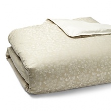 Scattered ginkgo leaves dance across soft green sateen in this elegant, airy collection from Barbara Barry. The yarn dyed motif, trimmed in solid ivory, lends a delicate sheen to this duvet. Scattered ginkgo leaves dance across soft green sateen in this elegant, airy collection from Barbara Barry. The yarn dyed motif, trimmed in solid ivory, lends a delicate sheen to this duvet.