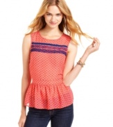 You'll look sweet as can be in Lily White's polka-dot top! Features lace trims and a cute peplum flare.