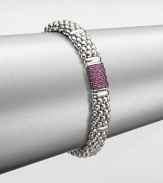 From the Muse Collection. An iconic caviar texture in sleek sterling silver accented with a pretty pink sapphire station. Sterling silverPink sapphireLength, about 7.5Box and tongue closureImported 