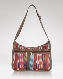 Ideal for the girl on the go, this versatile LeSportsac design features easy-access pockets and an adjustable strap - wear it over the shoulder or crossbody to keep hands free while holding it all.