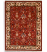 A long runner that is ideal for hallways and entryways. In homage to renowned artist William Morris, this rug features his signature vine and pomegranate motifs framed by an acanthus leaf border inspired by a Morris & Co. tapestry. A special dyeing process imparts subtle shadings to a dynamic palette of blues, greens, terra cotta, saffron yellow and ivory tones on a warm red ground. The resulting striated effect recreates the depth of hue achieved by aged vegetable dyes. Woven of premium worsted wool and finished with a patented luster wash for indulgent softness.