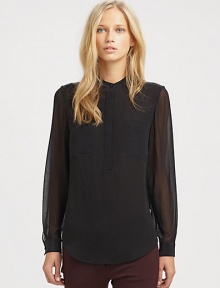 A sheer back and hi-lo hem lend a modern edge to this elegant, silky design. Banded round necklineLong button cuff sheer sleevesConcealed front button placketHi-lo hemSheer back panelAbout 29 from shoulder to hemSilkDry cleanImportedModel shown is 5'10 (177cm) wearing US size 4.