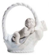 A little basket of joy. Moms and dads will cherish this beautiful Lladro figurine celebrating the birth of their baby boy in fine porcelain.