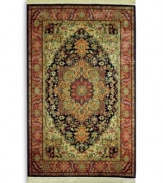 A beautiful example of traditional heriz designs, this rug features a bold navy center medallion surrounded by intricate florals in lighter shades of red and green. The combination of graceful lines and geometric shapes creates an exquisitely balanced pattern. Each color is individually skein-dyed for jewel-tone clarity. A patented wash process creates a vintage finish faithful to the craftsmanship of the original. Woven in the USA of premium fully worsted New Zealand wool.