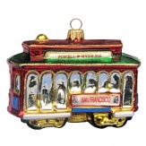 A glass holiday ornament rendition of the classic San Francisco cable car.