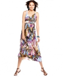 The bright, colorful print splashed across ECI's stretch jersey maxi dress gives this chic favorite a fresh, exotic update. The bright, colorful print splashed across ECI's stretch jersey maxi dress gives this chic favorite a fresh, exotic update.