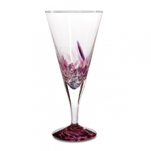 Each wine glass is carefully hand-blown in Florence by experienced craftsmen who perform a ten-step, six-hour process, blending Venetian color chips with silvery sparkles for a scintillating confluence of shimmer and hue. Each wine glass is carefully hand-blown in Florence by experienced craftsmen who perform a ten-step, six-hour process, blending Venetian color chips with silvery sparkles for a scintillating confluence of shimmer and hue.