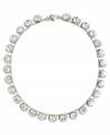 Simply stunning. Add glitz and glamour to your evening look with this chic collar necklace from Monet. Featuring a sparkling array of Swarovski crystals, it's crafted in silver tone mixed metal. Approximate length: 18 inches.