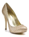 Hey, twinkle toes. Make every step shine in these glitter-covered platform pumps from IVANKA TRUMP.