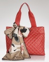 Swap the staid tote bag in favor of this quilted leather style from Love Moschino. Accessorized with a bold scarf, this bag lives to enliven your daytime uniform.