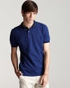 A stripe trim at the collar adds a subtle, unique touch to a classic polo from Burberry.