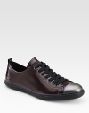 An elegant update on a timeless design, crafted in smooth patent leather with a metal toe cap. Leather liningPadded insoleRubber soleImported