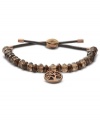 The smoky beads on this Fossil bracelet add allure to a casual style. An adjustable chocolate brown leather cord holds it all together. Includes a brown ion-plated coin charm. Approximate diameter: 2-1/4 inches.