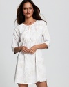 A chic paisley print short caftan with three-quarter sleeves and smocking at neckline.