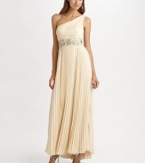 A gorgeous floor-length silhouette shaped with a beaded empire waist and flouncy sunburst skirt.One-shoulder styleConcealed side zip closureCrinkled bodiceEmpire waistPleated sunburst skirtAbout 45 from natural waistFully linedPolyesterDry cleanImportedModel shown is 5'10 (177cm) wearing US size 4.This style runs true to size. We recommend ordering your usual size for a standard fit. 