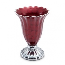 Sandcast by hand and hand-painted with a specially colored enamel that's mixed with crushed mother of pearl, this vase from Julia Knight adds a luxe touch to any decor.