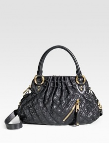 A graceful pouch shape in rich, quilted leather with bold golden hardware and a removable shoulder strap. Double handles, 5 drop Removable crossbody shoulder strap, 20 drop Top zip closure One outside zip pocket Inside open and zip pockets Cotton lining About 14W X 10H X 4D Made in Italy