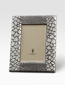 A meticulously handcrafted, platinum-plated frame with a stretched leather back. From the Python Collection Accommodates a 4 X 6 photograph Platinum platingBeveled glass, stretched Italian leather backingImported A meticulously handcrafted, platinum-plated frame with a stretched leather back. From the Python Collection Accommodates a 4 X 6 photograph Platinum platingBeveled glass, stretched Italian leather backingImported