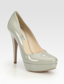 Patent leather style with rounded toe and platform. Self-covered heel, 5 (125mm)Covered platform, 1 (25mm)Compares to a 4 heel (100mm)Patent leather upperLeather lining and solePadded insoleMade in ItalyOUR FIT MODEL RECOMMENDS ordering true whole size; ½ sizes should order the next whole size up. 